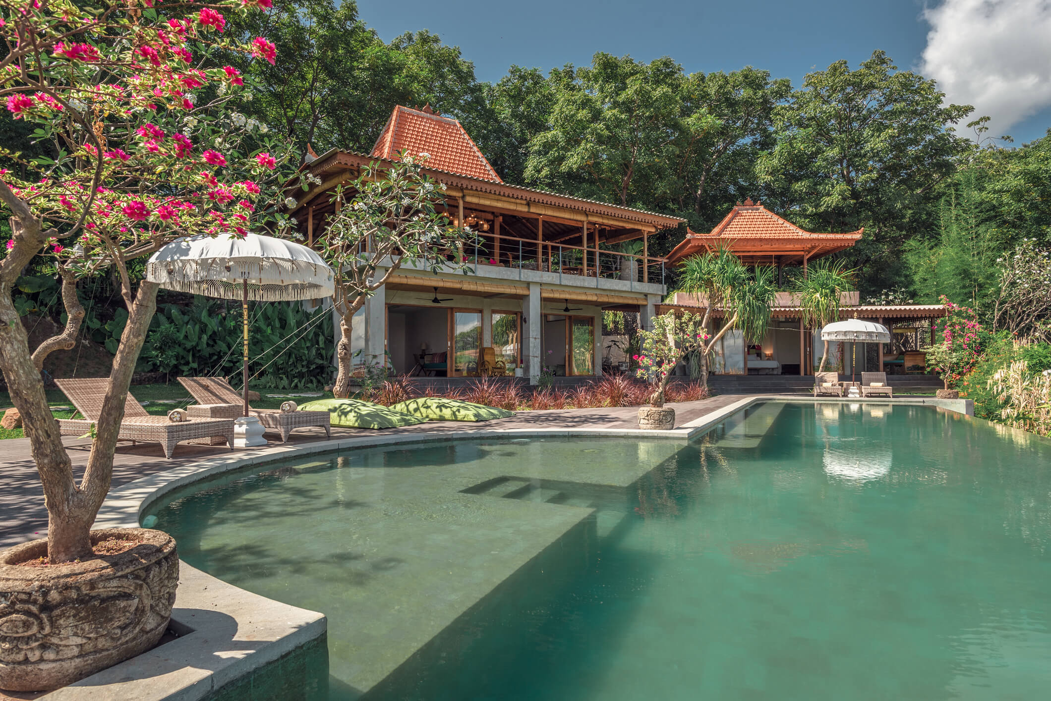 Exterior view of Villa Jamu showing infinity pool and lush gardens