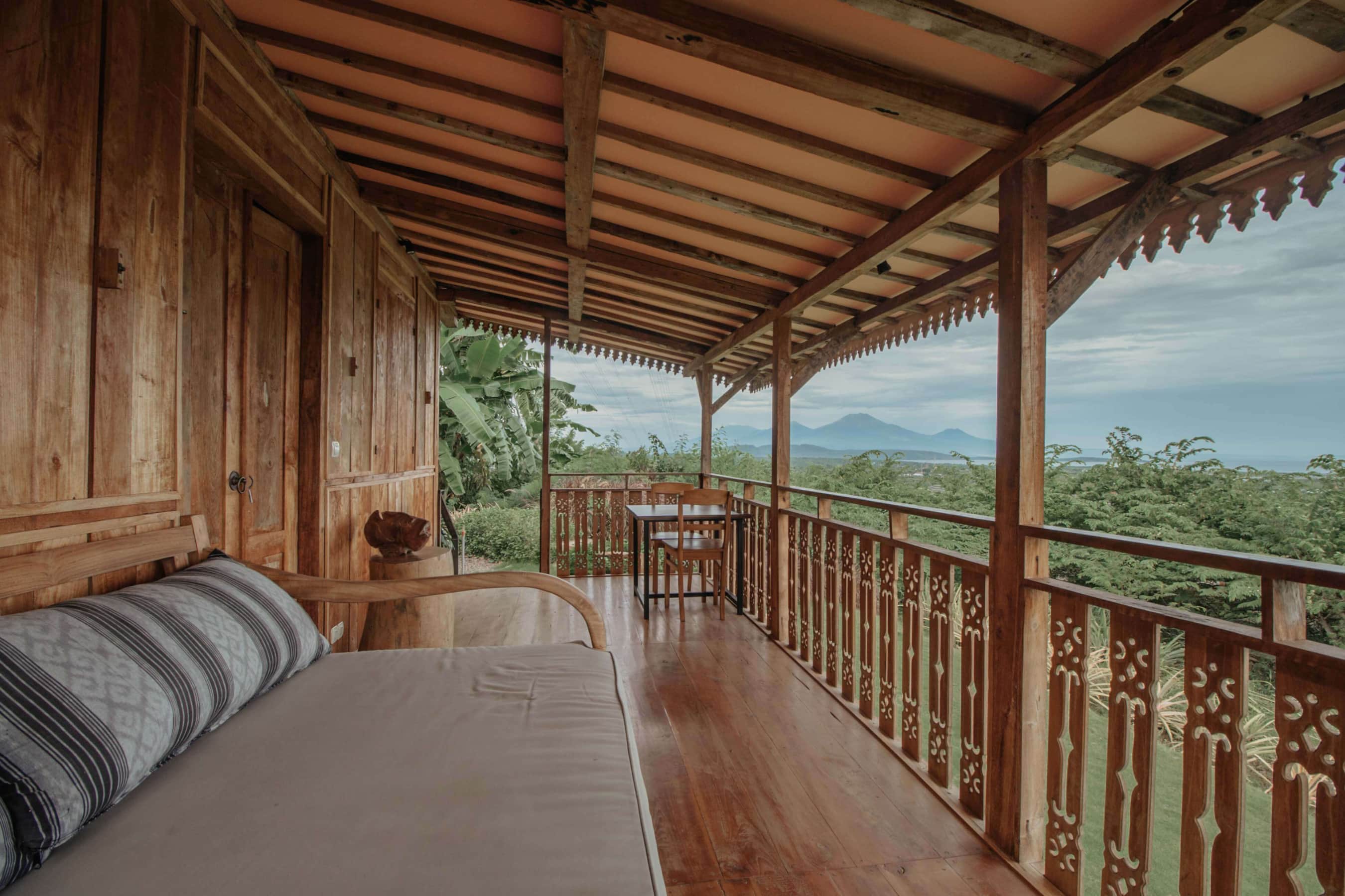 Front view of Kesambi 1 wooden house with natural wood exterior