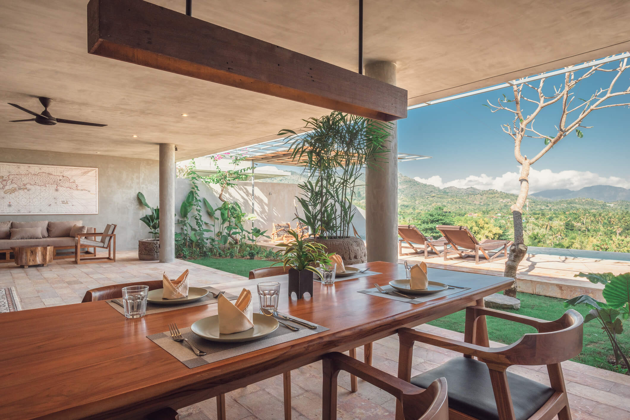 Villa Asti exterior showing modern architecture with infinity pool and tropical landscaping