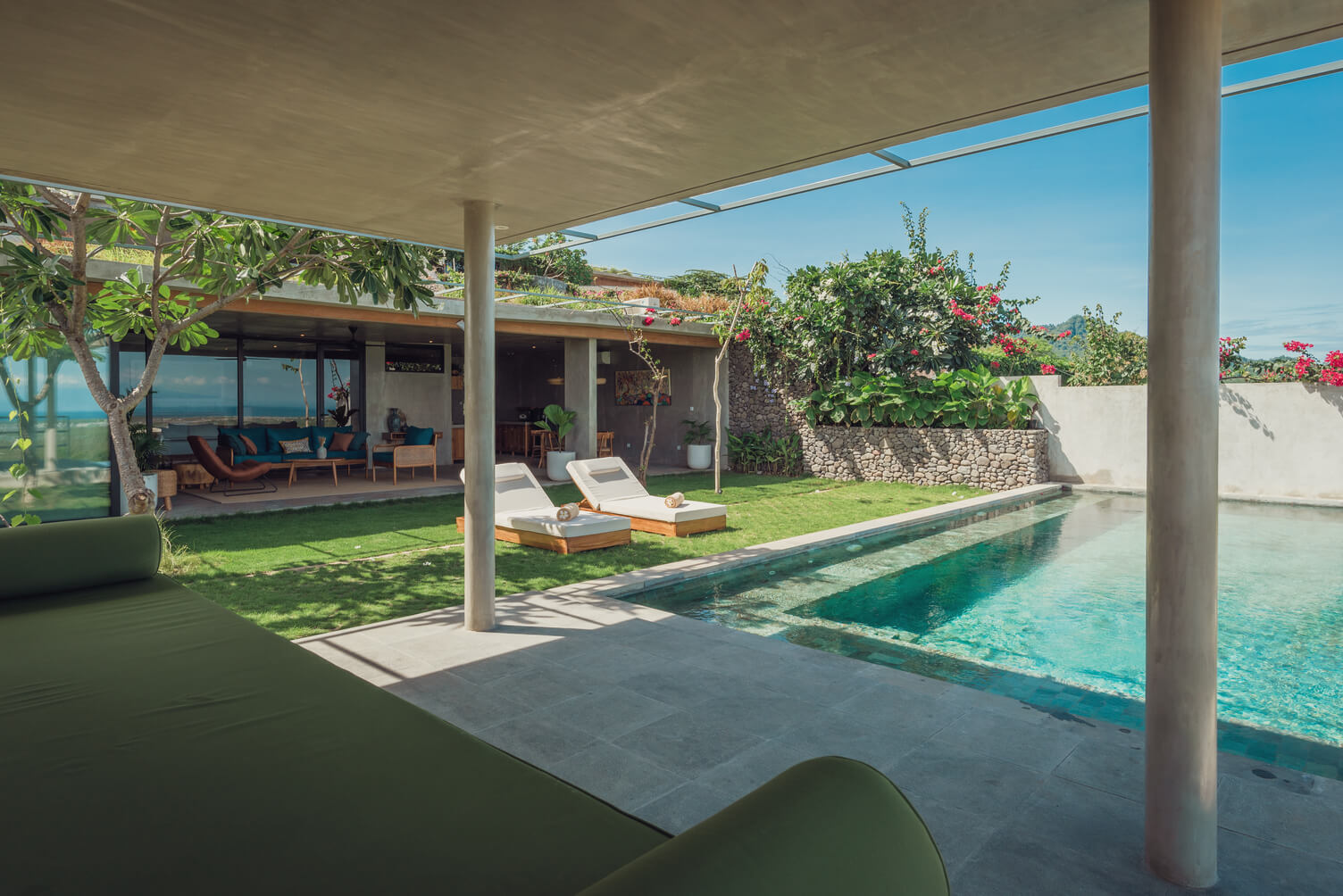 Exterior view of Villa Kupu Kupu surrounded by tropical gardens