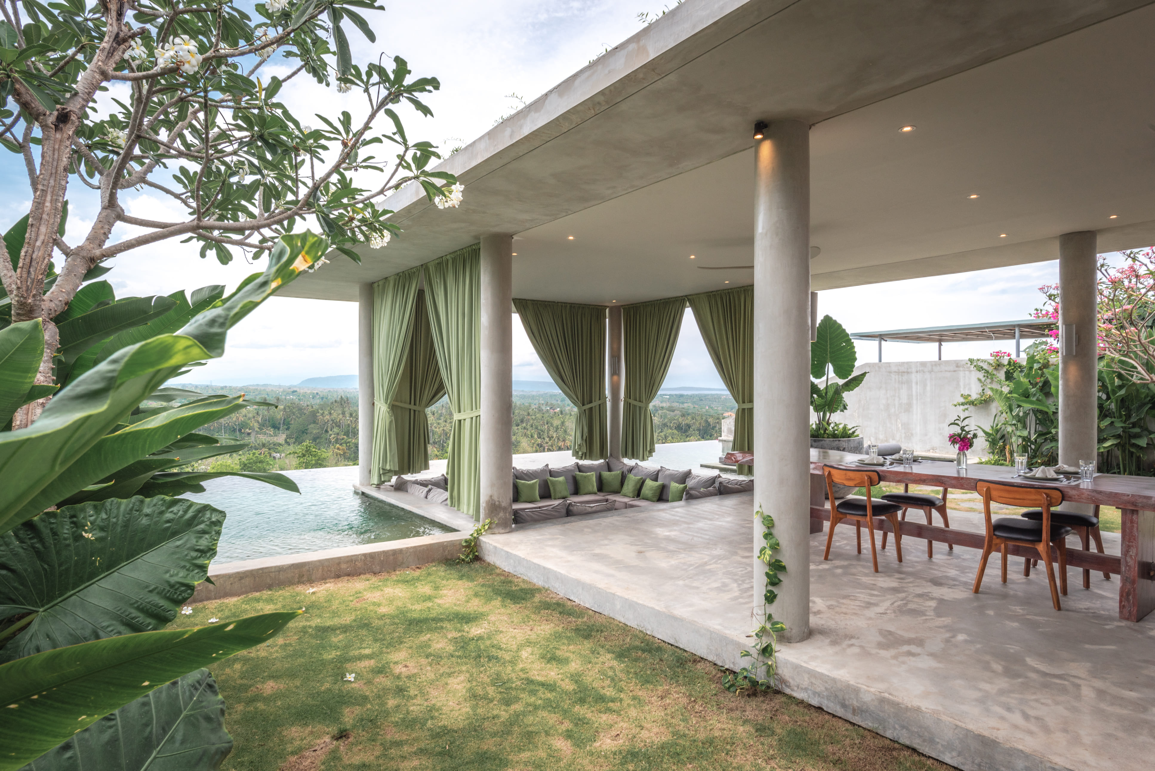 Sunken lounge and private infinity pool at Villa Pindo, Sumberkima Hill with green curtains and valley view